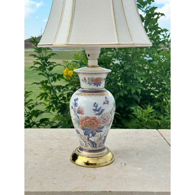 Vintage West German Kaiser porcelain table lamp on brass base with coordinating shade. Decorated with a "Duchesse"...