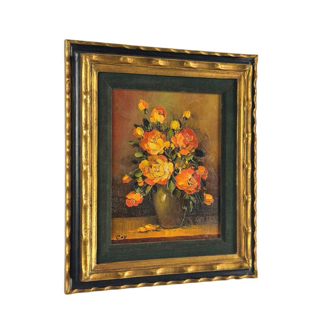 Yellow and orange roses fill this vintage floral still life, their bright petals set against a softly shaded brown and...