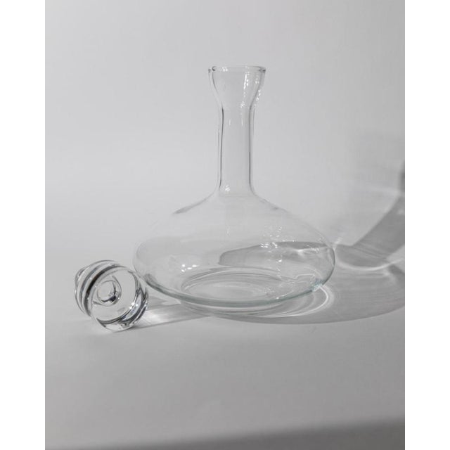 This vintage glass decanter from 1980s Italy showcases classic, timeless design and excellent craftsmanship. Made from...