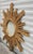 Stunning Italian handpainted carved Giltwood sunburst mirror, with radianting ray design. Design to elevate your decor,...