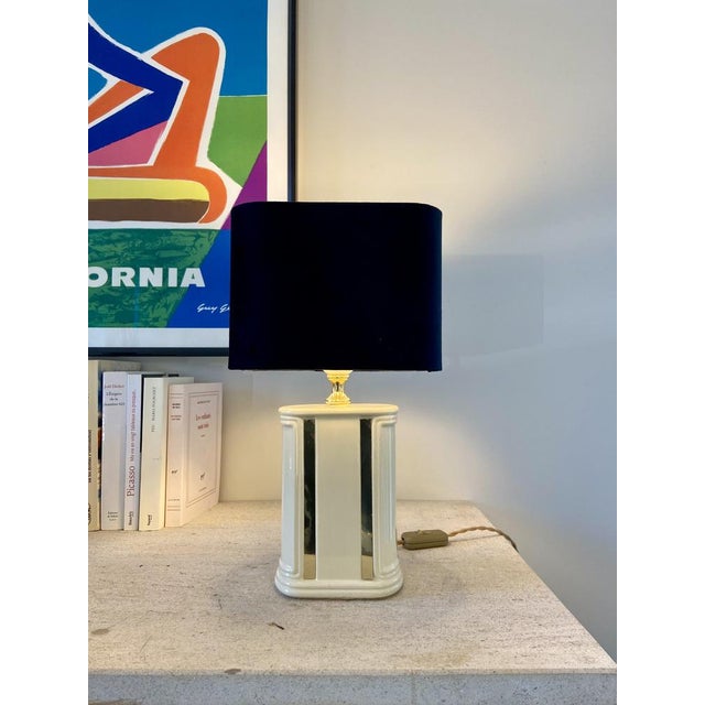 Cream and gold colored ceramic lamp base. In very good condition. 1950s. The foot has stood the test of time and has a few...