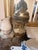Impressive vintage Neoclassical-style decorative covered jar featuring a substantial clear glass body surrounded by...