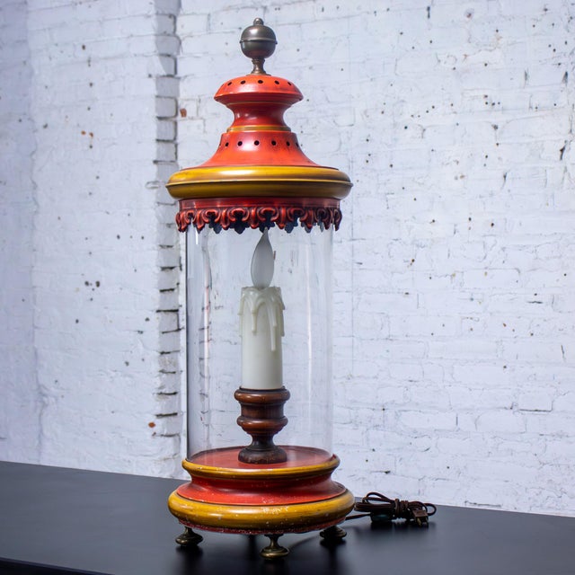 Fabulous vintage Campaign style hurricane lantern table lamp composed of an orange & yellow painted metal base & lid...