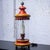 Fabulous vintage Campaign style hurricane lantern table lamp composed of an orange & yellow painted metal base & lid...
