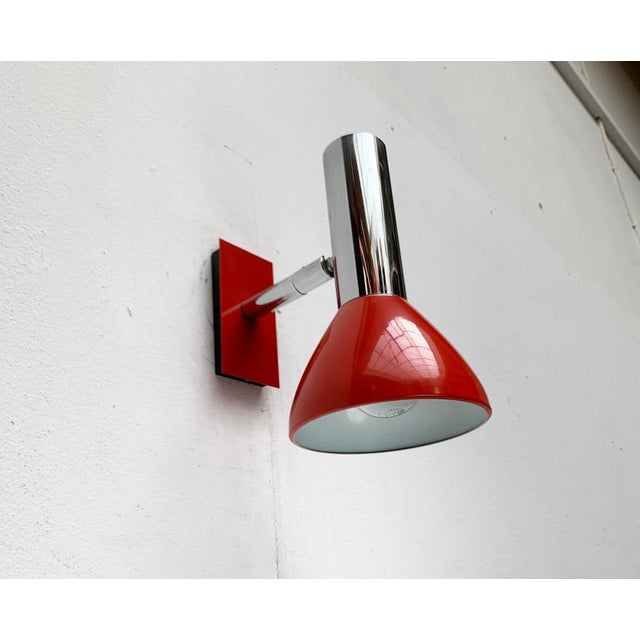 Simple wall lamps from Hustadt shine in a special color. The light head shows a simple form of spotlight. He can be...