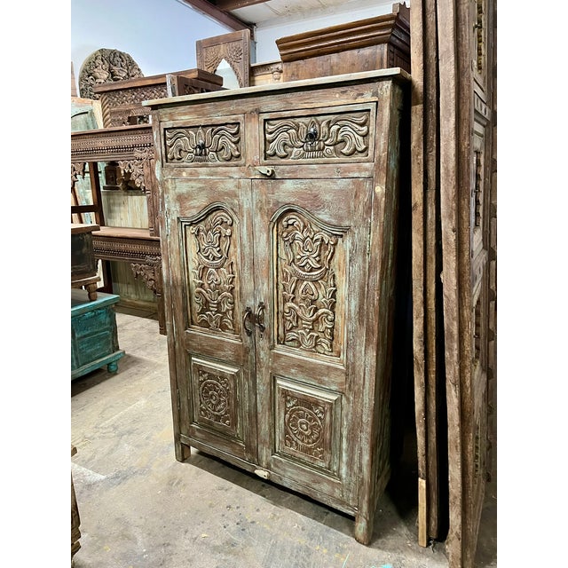 This Antique Floral Carved Closet Armoire combines vintage artistry with practical storage. Handcrafted from teak wood,...