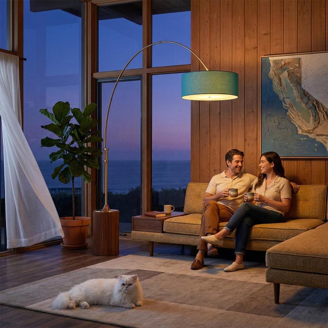The Tambo Arc Lamp is a striking Mid-Century Modern lighting piece designed by Peter Morelli in 1984. This elegant arc...