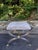 Striking vintage Hollywood Regency curule bench featuring a sculptural X-form frame in polished nickel with contrasting...
