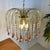 Chic chandelier in Hollywood regency style designed by Paolo Venini. This has a 3-layer design and is equipped with 5 E14...