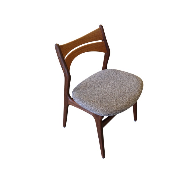 A very exclusive and well-crafted chair with a frame in solid oiled teak. The chair is in model 310, designed by Erik Buch...