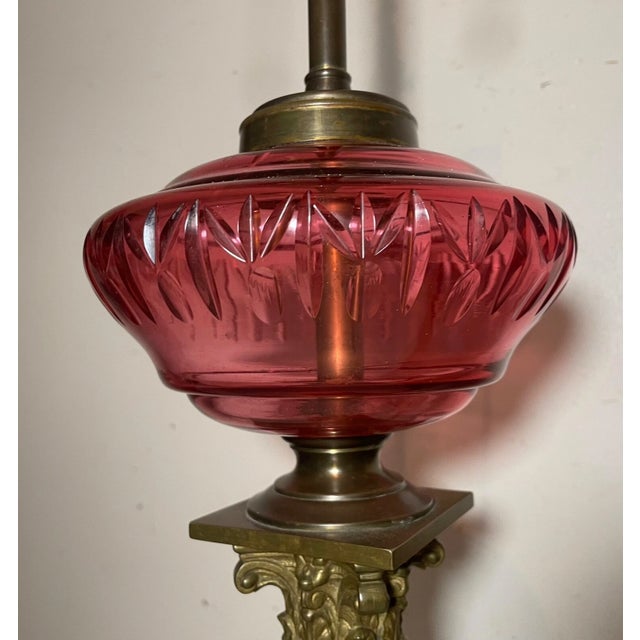 Antique Ornate Gilt Bronze Cranberry Cut Glass Electrified Oil Pillar Table Lamp For Sale - Image 9 of 12