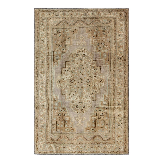 Vintage Turkish Floral Medallion Oushak in Earth Tones, Lavender, and Ice Blue 7'2 X 11'0 For Sale