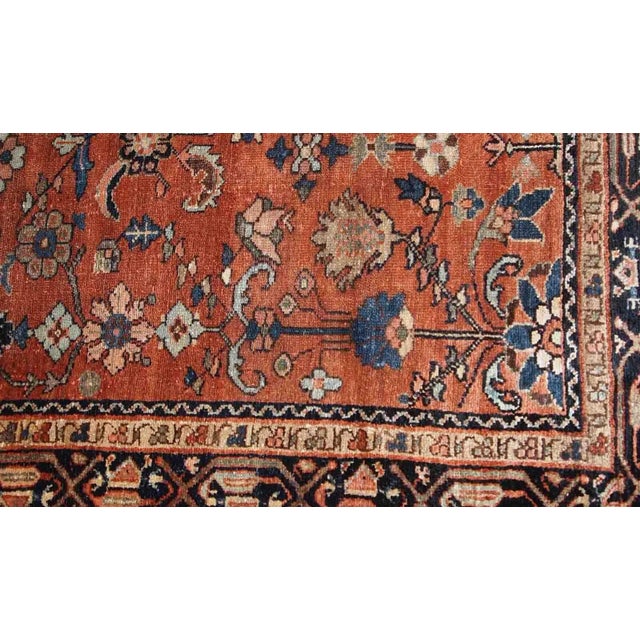 Hand made antique Hamadan rug from the beginning of 20th century. The rug is in red wool and in original good condition....