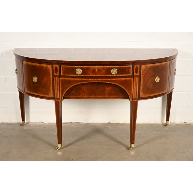 A gorgeous Federal or Hepplewhite style demilune sideboard, buffet, or credenza By Baker Furniture, "Colonial...