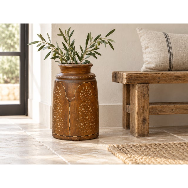 The arches are the first thing you notice. Each panel on this antique pot is outlined in a dashed line of pale inlay, and...