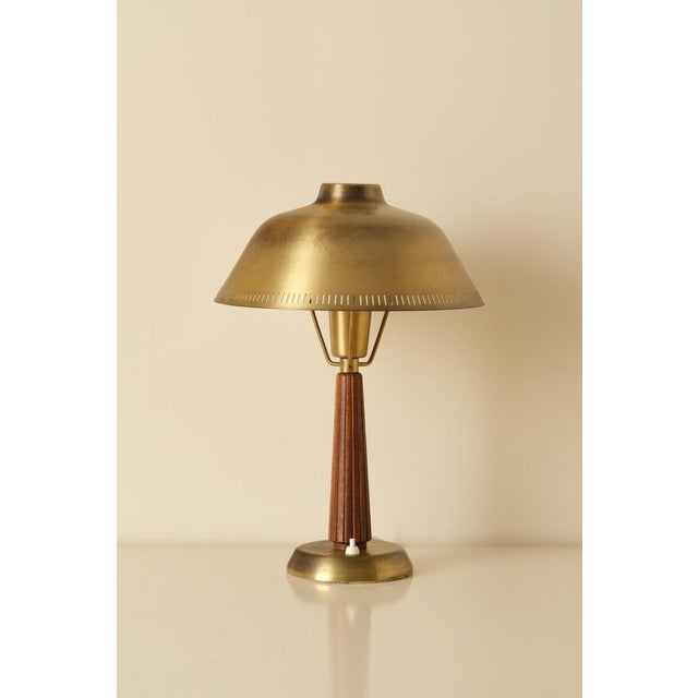 Swedish table lamp by Hans Bergström, teak and brass. Produced by ASEA, 1950s. New wiring. This piece is attributed to the...
