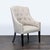 This Cisco Bros lounge chair features a stylish tufted back design and soft light beige upholstery. The gently curved arms...