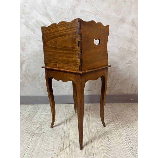 Add character and charm to your interior with this small solid wood bedside table, in the antique Louis XV style. Ideal as...
