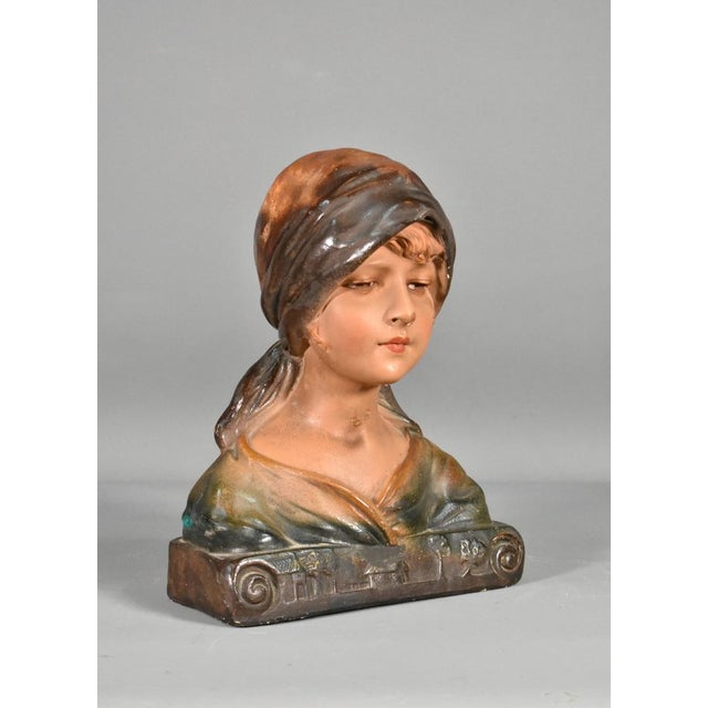 French antique bust of a young girl in plaster a pretty polychrome plaster bust of a young girl wearing a headscarf with...