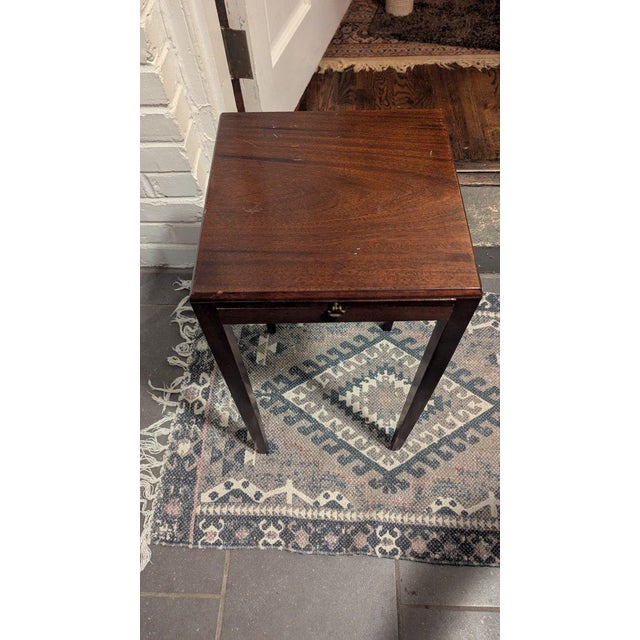 A beautiful vintage solid mahogany square candle stand accent table, showcasing elegant Hepplewhite-style tapered legs and...