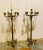 A pair of French empire bronze candelabrum from the early 19th century, about 1815. All chains are intact and these are in...