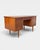 Classic Danish desk from the 1960s, finished in teak veneer. Its clean, elegant form, slender tapered legs and...