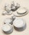 Vintage mid-century fine china dinnerware set by Fairfield in the classic, romantic "Rosepoint" pattern. This set features...
