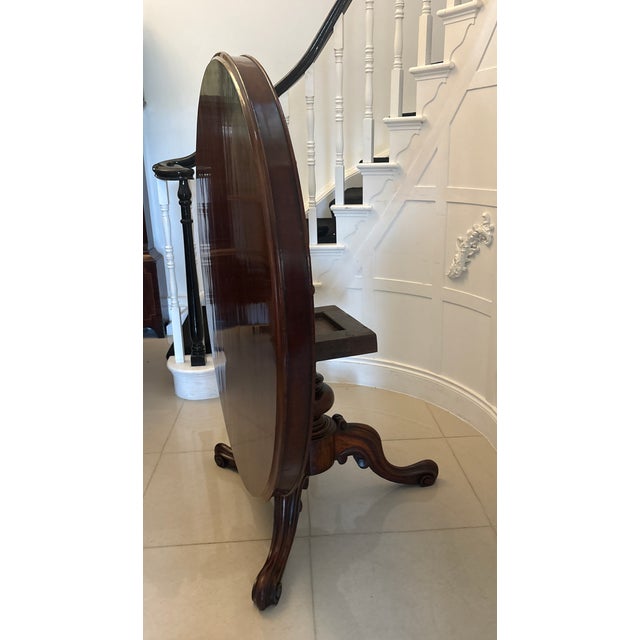 This antique Victorian mahogany circular dining or centre table is an impressive and highly versatile piece, distinguished...
