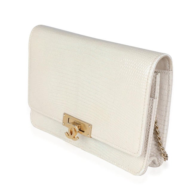 Item #: 114357 Interior Material: Fabric Dimensions: 7.3 x 5 x 1 in Features Interior: Two slip pockets. Two zip pockets....