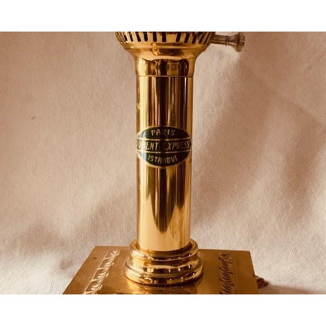 Step aboard the golden age of luxury travel with this stunning Vintage Orient Express inspired table lamp, circa 1980....