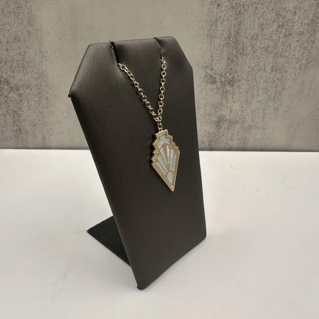Add a touch of elegance to your jewelry collection with this stunning Mother of Pearl Necklace, crafted in 14kt Yellow...