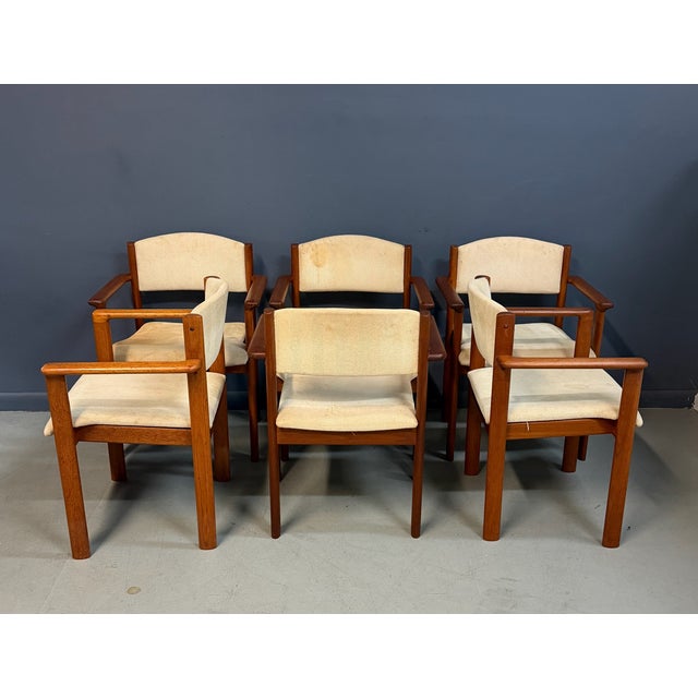 Exceptional set of Scandinavian modern stacking armchairs crafted in richly grained teak, likely produced in Denmark or...