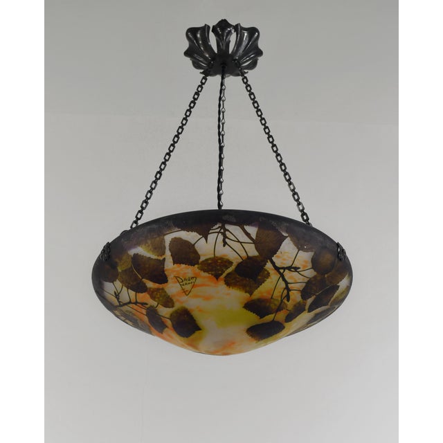 Daum freres & Louis Majorelle poplar autumn leaves A wonderful French art deco hanging fixture in wrought iron with a...