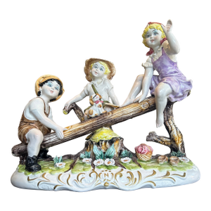 Large Capodimonte Porcelain Figural Sculpture of Children and Dog on Seesaw Mid to Late 20th Century