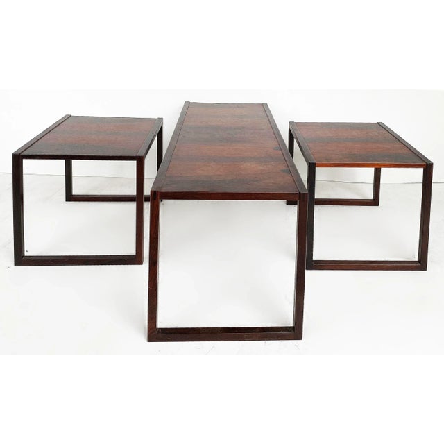 Scandinavian Modern Rosewood Coffee Nest Side Tables, Illegibly Signed Offered for sale is a set of a Scandinavian mid-...