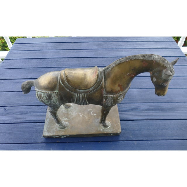 This impressive Chinese bronze horse sculpture is a powerful and beautifully rendered work, notable for its large scale,...