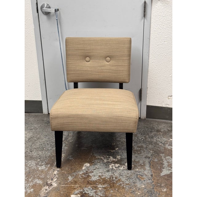 Design Plus Gallery presents a Slipper Chair from Crate & Barrel. Inspired by Mid-Century Modern style, the armless chair...