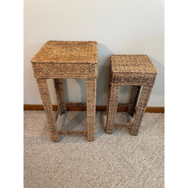 An attractive pair of woven wicker Seagrass Plant Stands or Stools. Circa Late 20th Century. These two stands are...