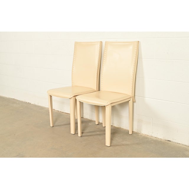 A sleek and stylish pair of Italian Modern or Postmodern high back side chairs or dining chairs In the manner of Mario...