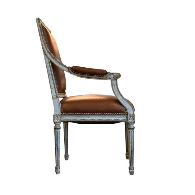 Elegant and timeless, this Louis XVI-style armchair brings a touch of classic French sophistication to any interior. The...