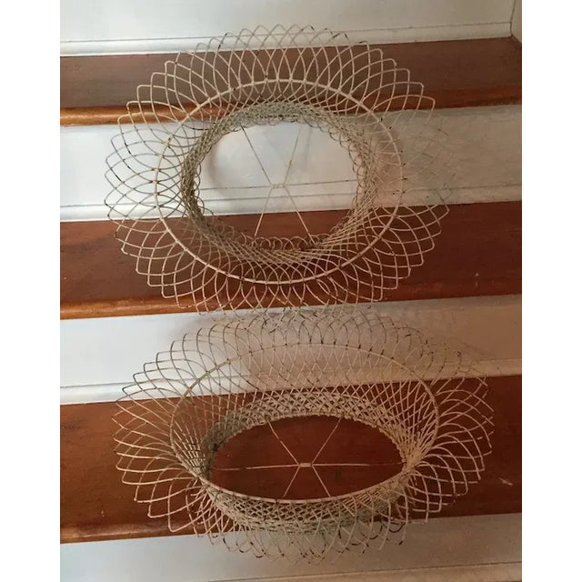 Pair antique 19th century French oval wirework garden baskets. Painted white. Each measures 18 1/2" x 16" x 7" tall. Good...