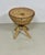 A very pretty wicker stool with a crossed base in exotic wood, elegantly held in place by a braided wicker collar. The...