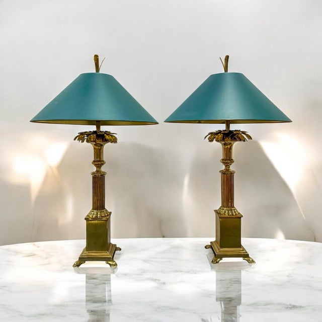 This is a fabulous pair of modern regency style brass pineapple form lamps by Chapman Manufacturing. They were...