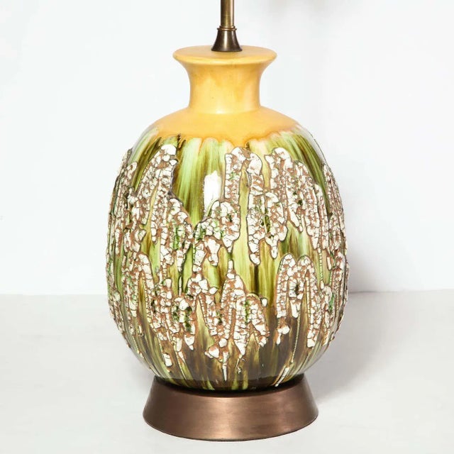 This sophisticated pair of Mid-Century Modern lamps were realized in the United States circa 1960. They feature...