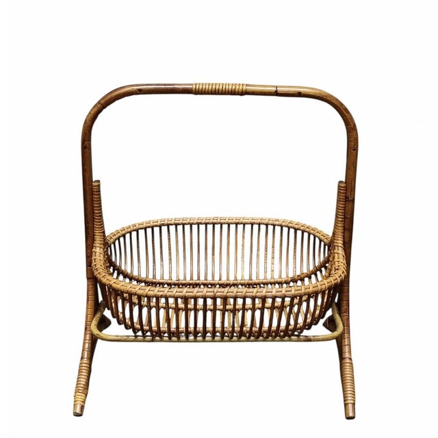 A stunning original vintage magazine rack dating from the 1960s, made entirely by hand from bamboo, curved bamboo and...
