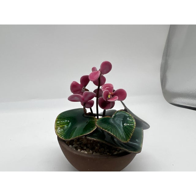 Bovano of Cheshire, circa 1960. A fine quality polychrome enamel decorated floral sculpture depicting Cyclamen Persicum.