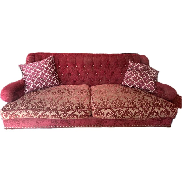 Circa 1970's upholstered velvet red burgundy sofa with two cushions , but seat easily 4 people. All the edging are...