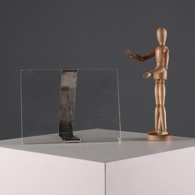 Lino Sabattini silver-plated metal tabletop photo frame. Engraved logo. This piece is attributed to the mentioned...