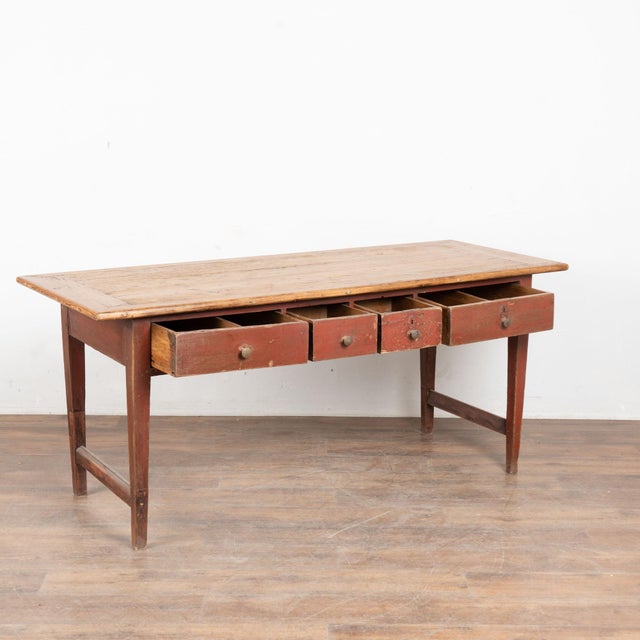 Early 19th century Swedish work console table, crafted in pine. Four drawers form the table skirt, including two larger...