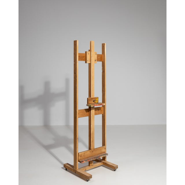 A 19th century French artist’s easel crafted in wood, featuring an adjustable structure designed for both painting and...